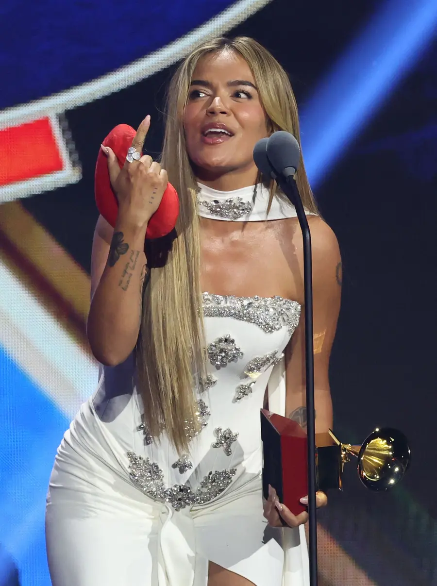 Colombian singer Karol G accepts the Song Of The Year award for "Si Antes Te Hubiera Conocido" onstage during during the 26th Annual Latin Grammy Awards at the MGM Grand Garden Arena in Las Vegas, Nevada on November 13, 2025. (Photo by VALERIE MACON / AFP)