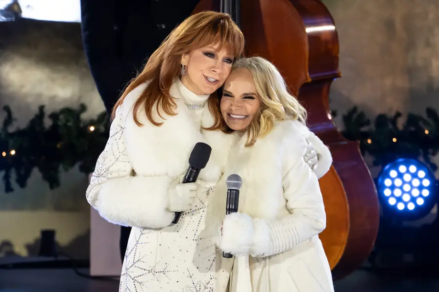 Reba McEntire, left, and Kristin Chenoweth, right, perform during the 93rd annual Rockefeller Center Christmas tree lighting ceremony, Wednesday, Dec. 3, 2025, in New York. (AP Photo/Yuki Iwamura)