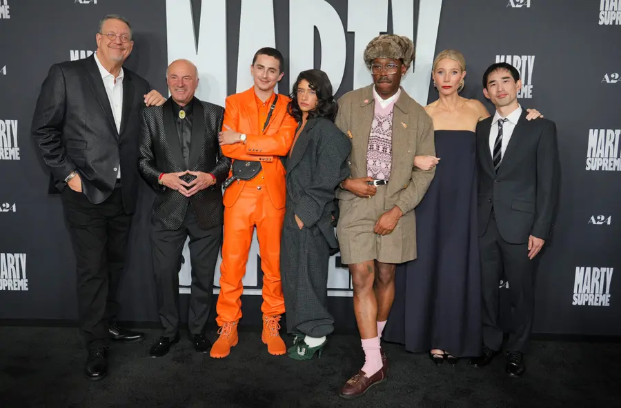 From left, Penn Jillette, Kevin O'Leary, Tyler Okonma, aka Tyler, The Creator, Timothee Chalamet, Odessa A'zion, Gwyneth Paltrow and Koto Kawaguchi arrive at the premiere of "Marty Supreme" on Monday, Dec. 8, 2025, at Samuel Goldwyn Theater in Beverly Hills, Calif. (Photo by Jordan Strauss/Invision/AP)