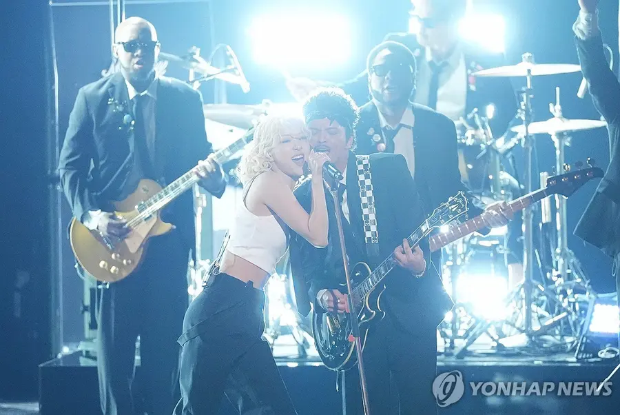 Rosé (from left) and Bruno Mars performing at the Grammy opening