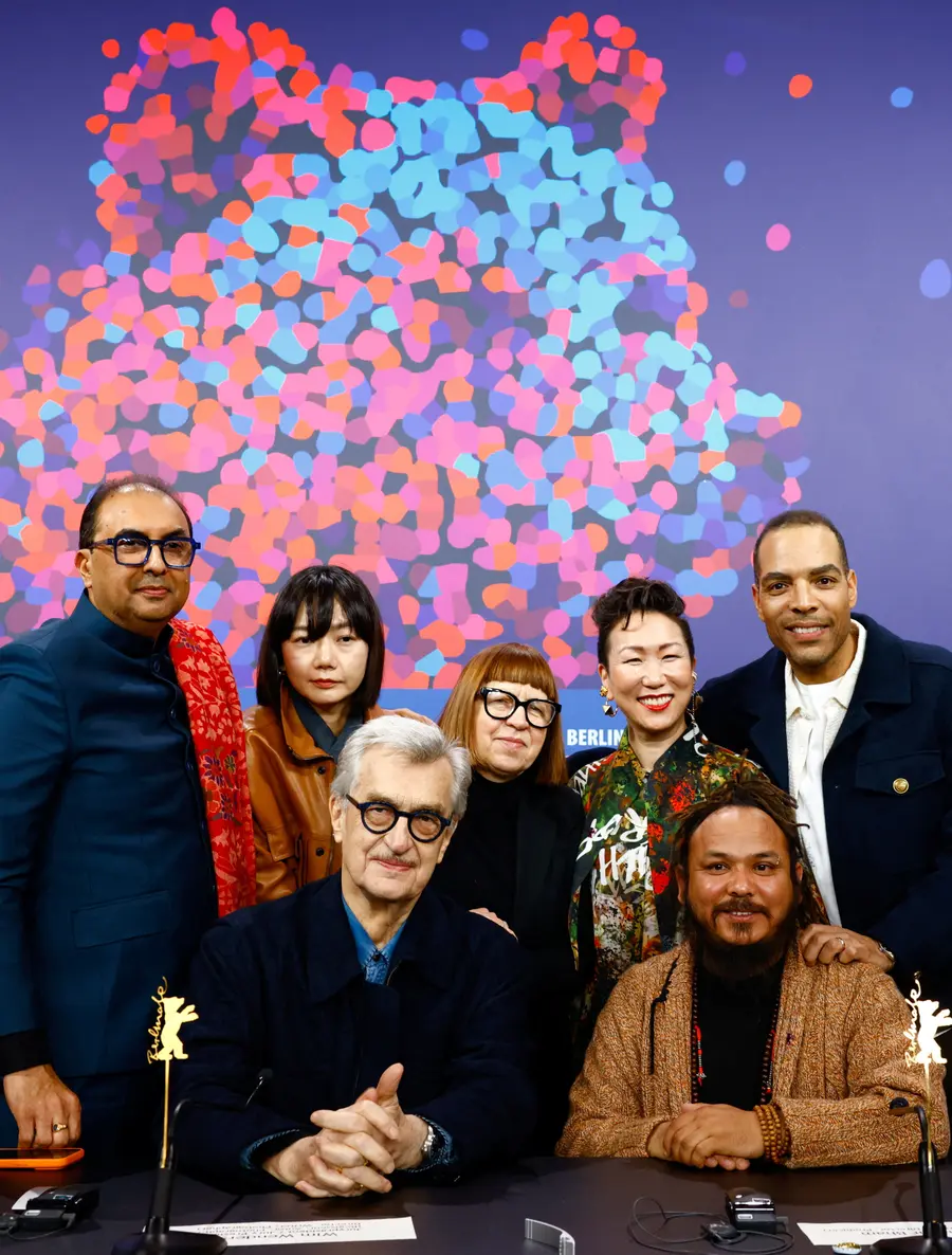 The jury members pose for photos at the press conference held before the opening ceremony. /REUTERS