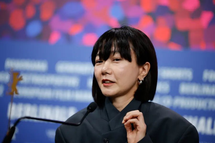 Actress Bae Doona attends the opening press conference of the Berlin Film Festival, looking at the press. /REUTERS