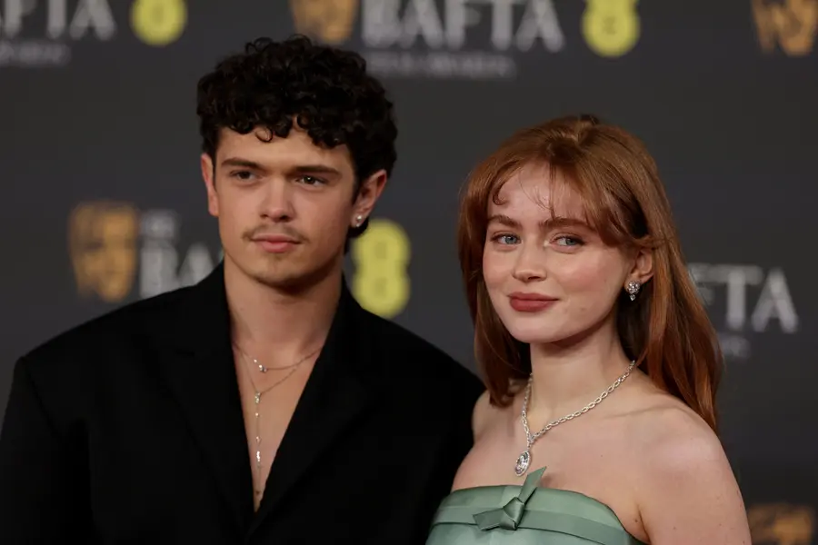 British actor Noah Jupe and American actress Sadie Sink pose on the red carpet at the British Academy Film Awards (BAFTA) held at the Royal Festival Hall in London on February 22, 2026. (Photo by Adrian Dennis / AFP)