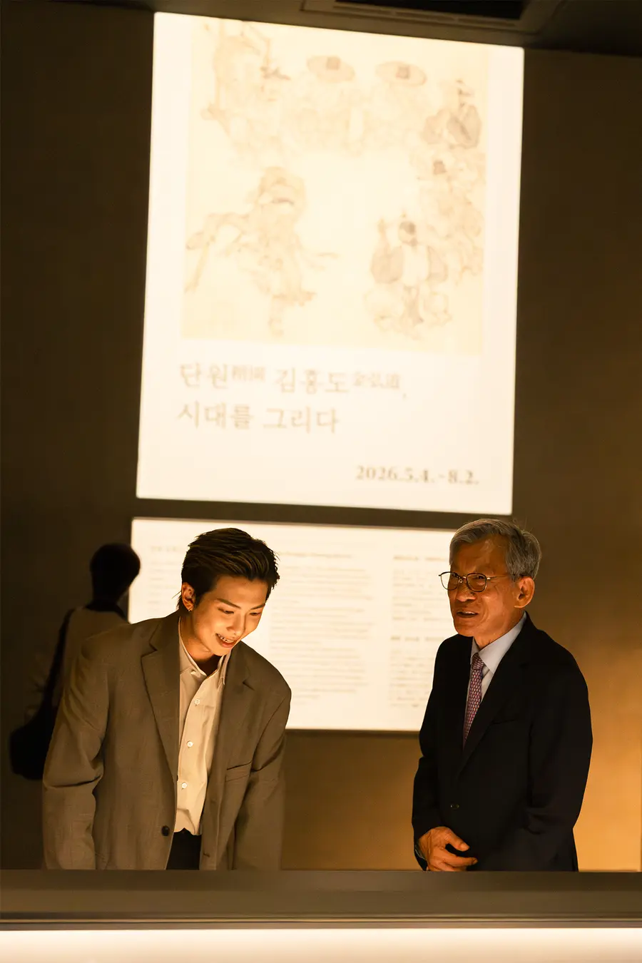 RM touring an exhibition in the calligraphy and painting gallery From left: RM of Bangtan Sonyeondan (BTS), the director of the National Museum of Korea [Provided by the National Museum of Korea. No resale or database use]