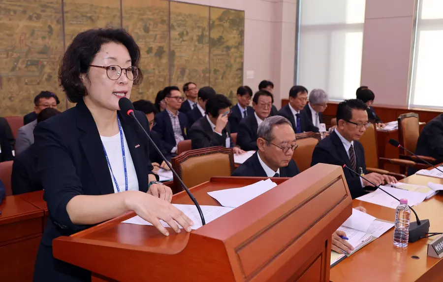 Kim Yoon-ji, president of the Korea Creative Content Agency, gives a work report at the Culture, Sports and Tourism Committee's parliamentary audit held at the National Assembly on Oct. 12, 2026